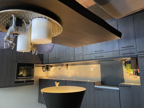 Property, Cabinetry, Countertop, Light, Wood, Interior Design, Kitchen, Flooring, Floor, Building