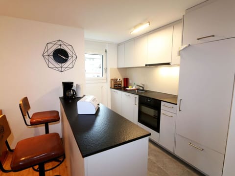 Cabinetry, Furniture, Property, Building, Countertop, Chair, Kitchen Stove, Wood, Table, Interior Design