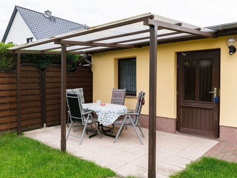 Plant, Building, Furniture, Shade, Chair, Wood, Lighting, Land Lot, Door, Table
