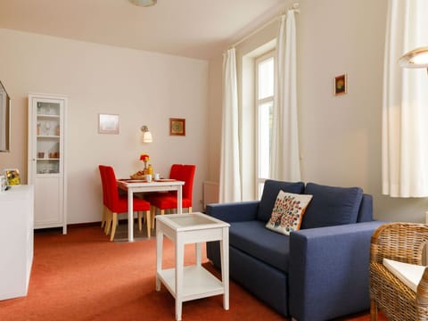 Furniture, Property, Picture Frame, Table, Comfort, Orange, Wood, Couch, Floor, Flooring