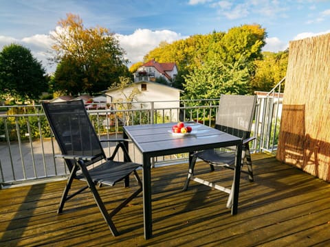 Cloud, Sky, Table, Plant, Furniture, Property, Building, Tree, Outdoor Table, Chair