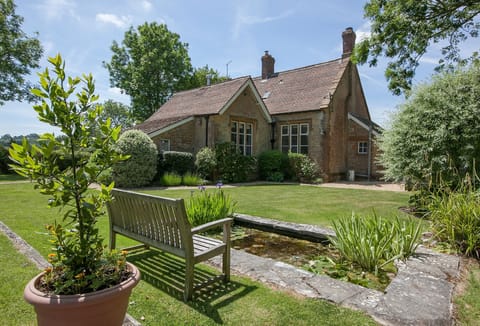 The Old School, South Perrott: a charming stone and tiled holiday country cottage which used to be the village school