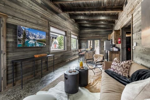 Step into our inviting open-concept space, where the living room seamlessly flows into the fully equipped kitchen. This layout creates the perfect environment for entertaining guests or keeping an eye on loved ones while preparing meals.