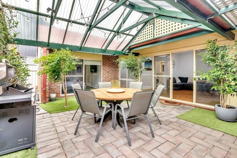 A generous undercover patio is complete with an outdoor dining table and BBQ for laidback alfresco entertaining.  

