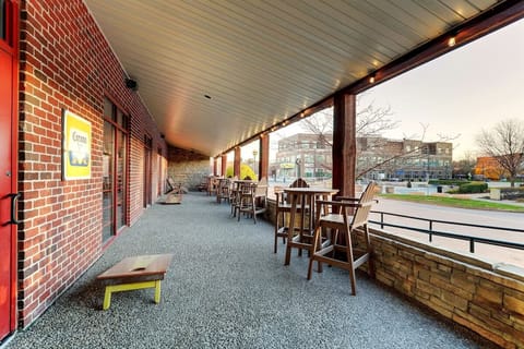 Unwind on the covered porch with café seating and sunset views.