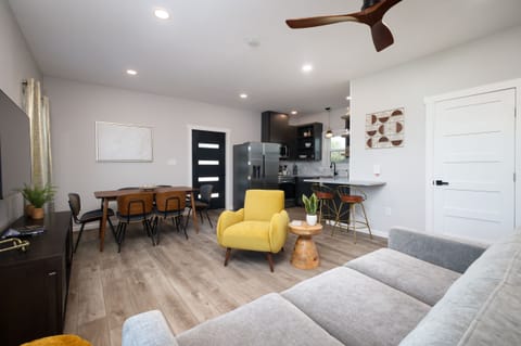 A meticulously decorated and comfortable living area with a pull out queen sofa bed. The sofa bed has a luxurious memory foam mattress with premium cotton linens.