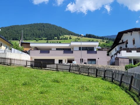 Sky, Cloud, Building, Mountain, Window, Highland, House, Land Lot, Natural Landscape, Grass