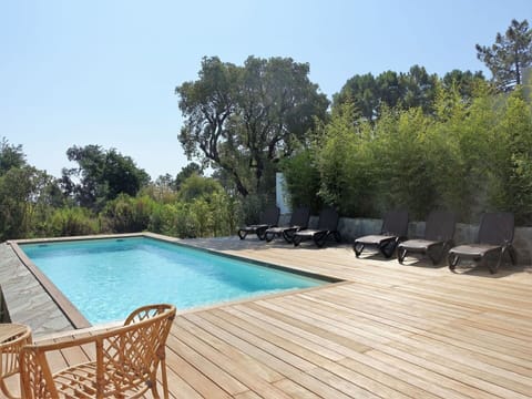 Water, Sky, Azure, Swimming Pool, Shade, Tree, Outdoor Furniture, Body Of Water, Grass, Natural Landscape