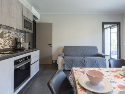 Property, Cabinetry, Table, Furniture, Countertop, Kitchen Stove, Wood, Dishware, Interior Design, Tableware