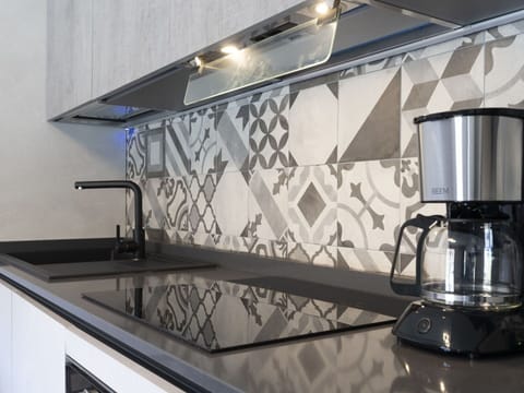 Kitchen, Interior Design, Shade, Wall, Material Property, Flooring, Gas, Glass, Kitchen Appliance, Countertop