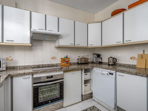 Cabinetry, Countertop, Property, Kitchen Stove, Kitchen Appliance, Kitchen, Building, Cooktop, Stove, Home Appliance