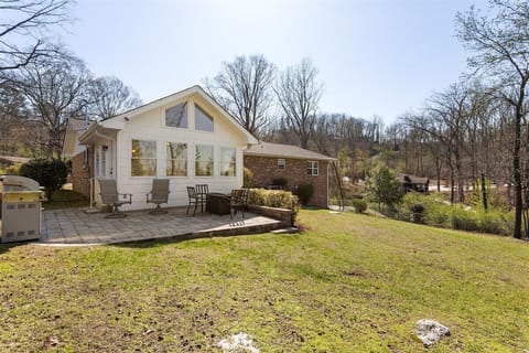 Back patio and fenced in backyard