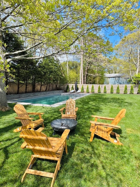 Fire pit and Adirondack chairs