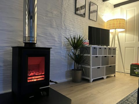 Log burning stove, drawers and lamp