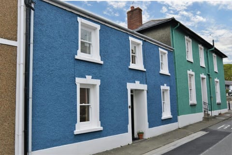 Outside front of Y Bwthyn, front door, pavement and street