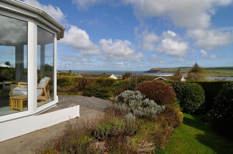 Conservatory and garden with distant sea view