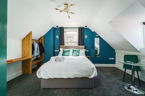 Studio 7 Bed, window, wardrobe