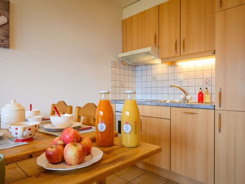 Food, Cabinetry, Property, Table, Furniture, Countertop, Wood, Kitchen, Orange, Interior Design