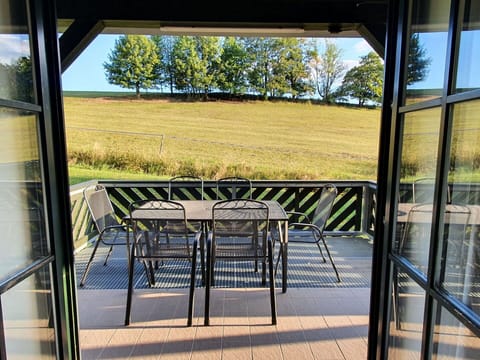 Plant, Property, Tree, Shade, Chair, Wood, Rectangle, Interior Design, Grass, Outdoor Furniture