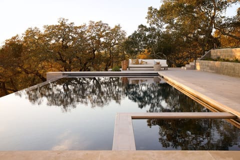 Take a dip in the luxurious infinity pool or relax in its adjoining spa