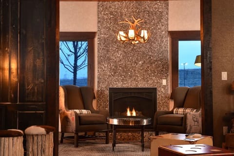 Cozy up by the flickering fireplace in intimate lounge seating.