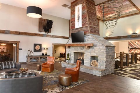 Gather fireside beneath soaring beams for cozy evening chats.
