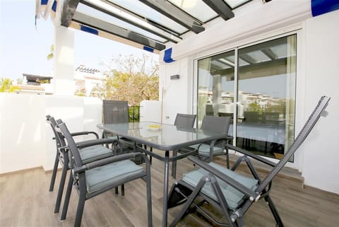 Outdoor dining area for six guests on the balcony