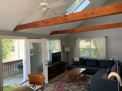 Living room with door to the long balcony deck on the left