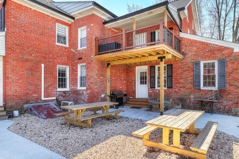 Outside entrance, second floor covered deck and shared space picnic tables.
