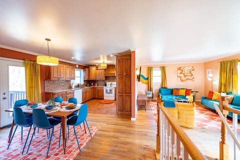 Open concept area showing living room, dining area, and kitchen