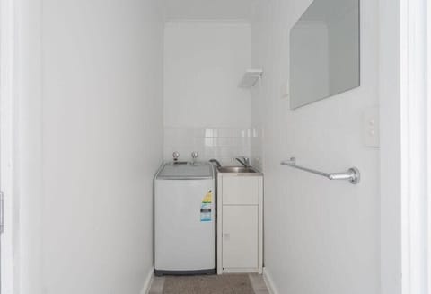 Enter into the laundry and separate toilet