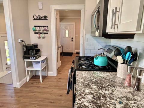 At left are the stairs down to the game room, laundry area, and full bath