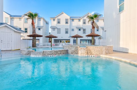 Outdoors - Soak up the sun by the sparkling community pool, complete with cozy loungers and shaded palapas.
