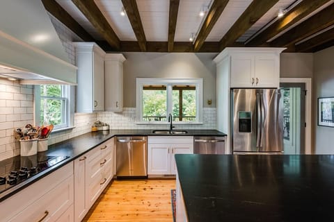 Fully stocked Kitchen is a home cooks dream - two wall ovens, two dishwashers, toaster oven, microwave, and an ice machine.  There's a second full size refrigerator in the lower level.