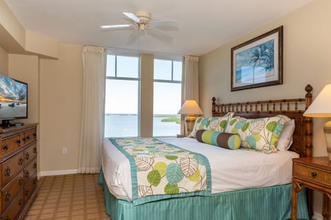Drift off comfortably with serene water views from bed.