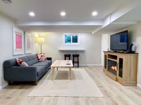 Spacious living room with smart TV and electric fireplace