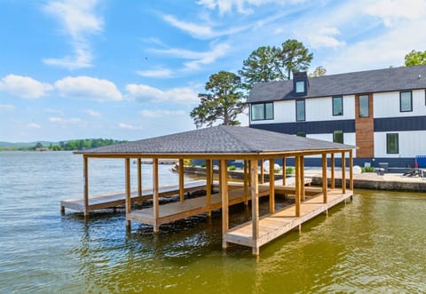 The covered private dock makes it easy to spend your days boating, fishing, or simply enjoying the peaceful water views.