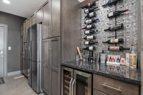 Secondary fridge and wine cooler area. We use this as our cocktail making bar :)