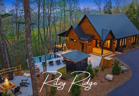 Welcome to Ritzy Ridge, this modern mountain oasis is awaiting YOU! Experience swimming with a picturesque mountain back drop. Laidback mountain luxury living!