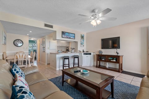 Relax in the living room with plenty of seating and natural light.