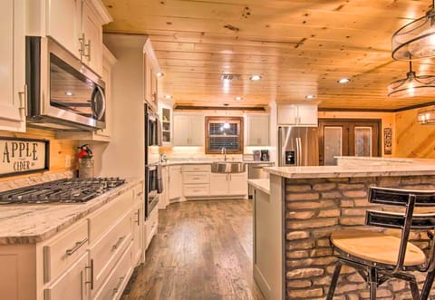 Delight in culinary creativity in our fully-equipped kitchen with breakfast bar seating - where memories and meals are made