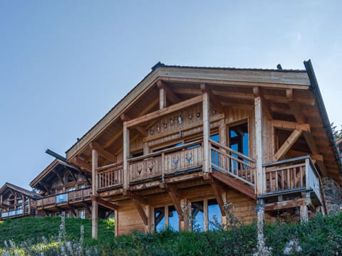 Sky, Building, Property, Table, Furniture, Cloud, Mountain, Interior Design, Outdoor Furniture, Wood