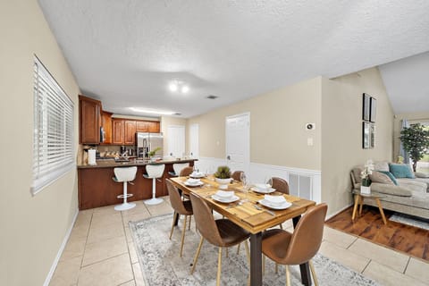 Spacious dining table that sits 6 with full tableware and silverware included.