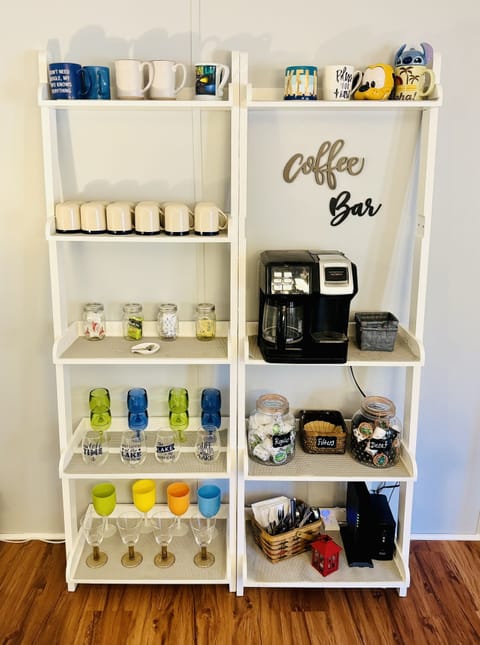 Fully stocked coffee bar. K-cup and regular coffee maker in one.