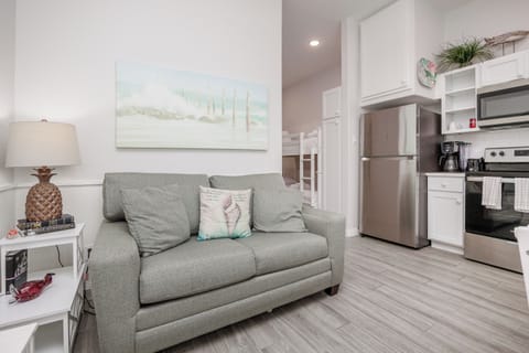 Comfortable living area with twin size sleeper sofa and flat screen TV