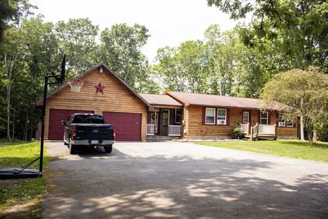 House exterior with large driveway with plenty of parking available 