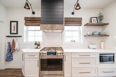 Amazing NEW kitchen. Quartz counters, GE Cafe Appliances, Dining Baguette.