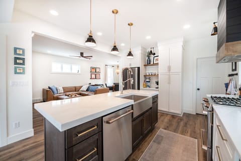 Amazing NEW kitchen. Quartz counters, GE Cafe Appliances, and island seats four.