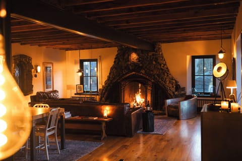 Gather around the dramatic floor-to-ceiling fireplace.