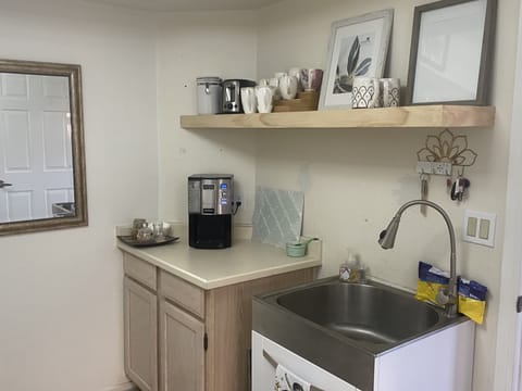 Coffee bar with sink in laundry area
